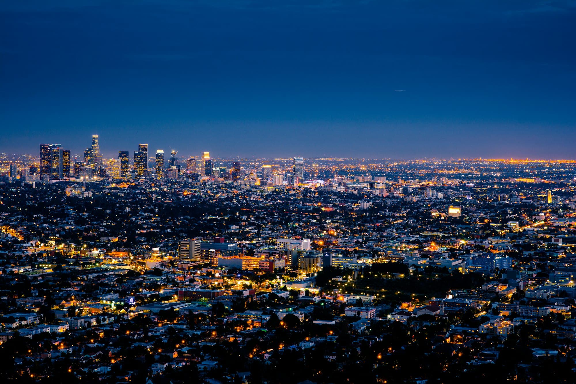Los Angeles skyline glowing gold at dusk